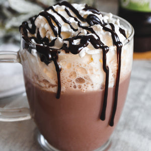 Hot chocolate with cream and a chocolate drizzle