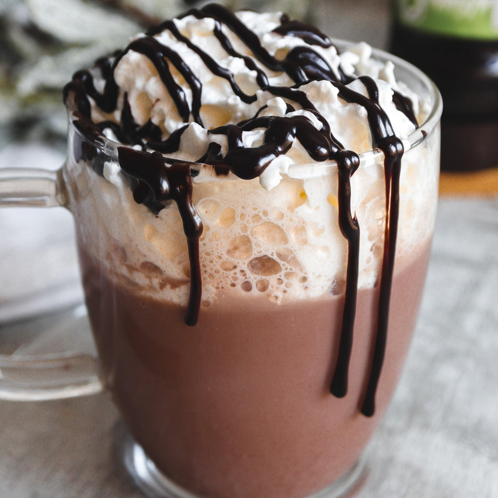 Hot chocolate with cream and a CHOC SHOT drizzle