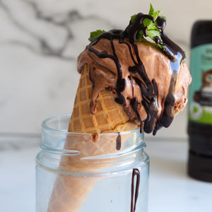 Chocolate ice-cream in a cone drizzled in CHOC SHOT Mint