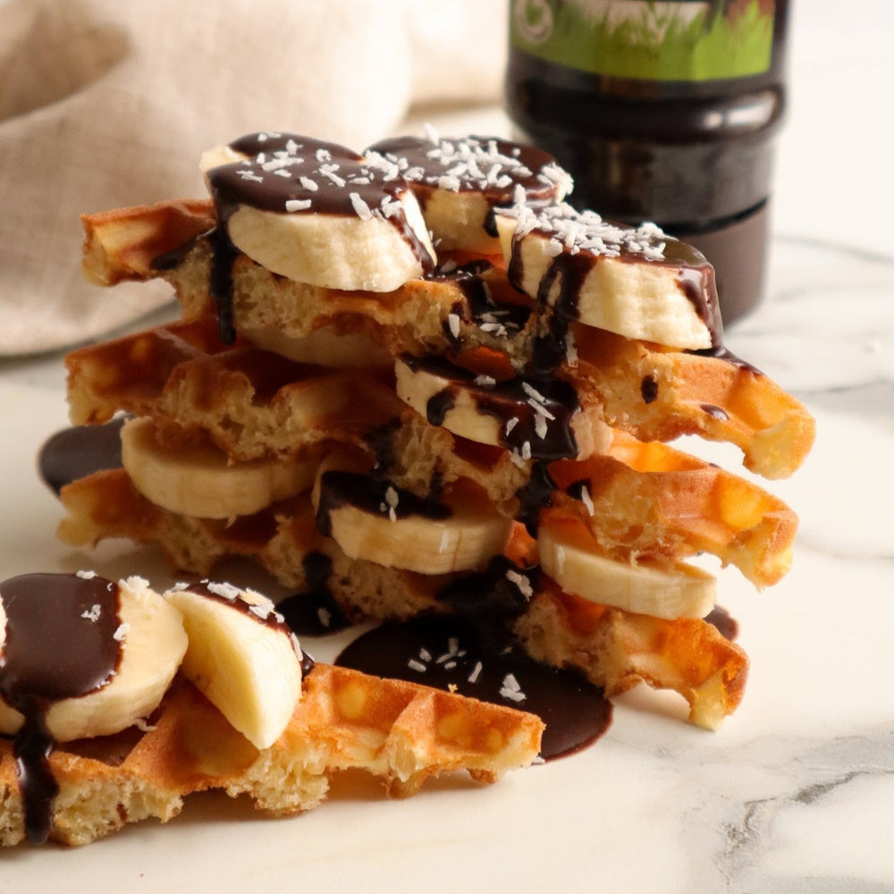 Waffles with banana, desiccated coconut and a CHOC SHOT Salted Caramel drizzle