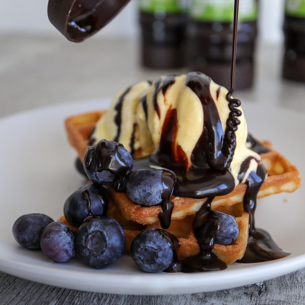 Waffles with blueberries and ice cream and CHOC SHOT Brownie drizzled on top